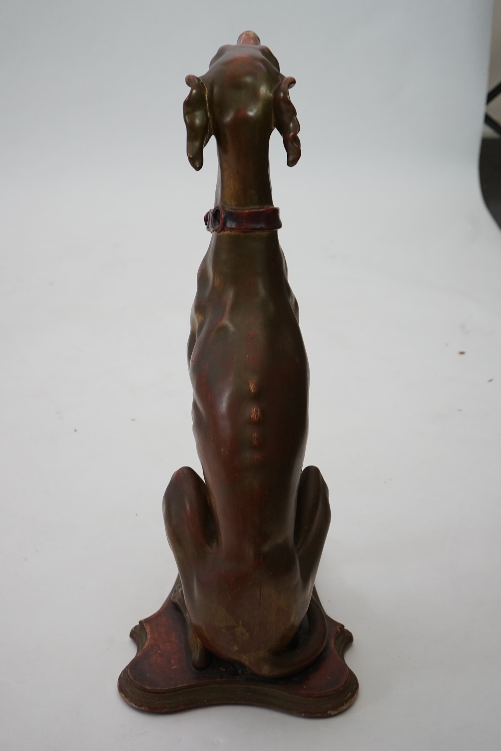 A 20th century Italian gilt and painted model of a seated Greyhound